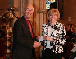 The Archbishop presents the award for Connor MU's In Touch newsletter to Kathleen Rodgers.